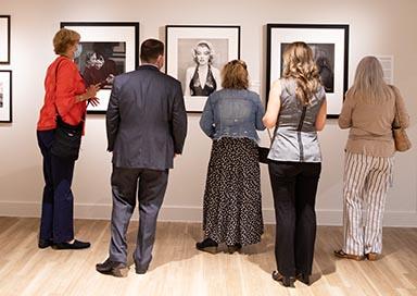 People looking at art in gallery